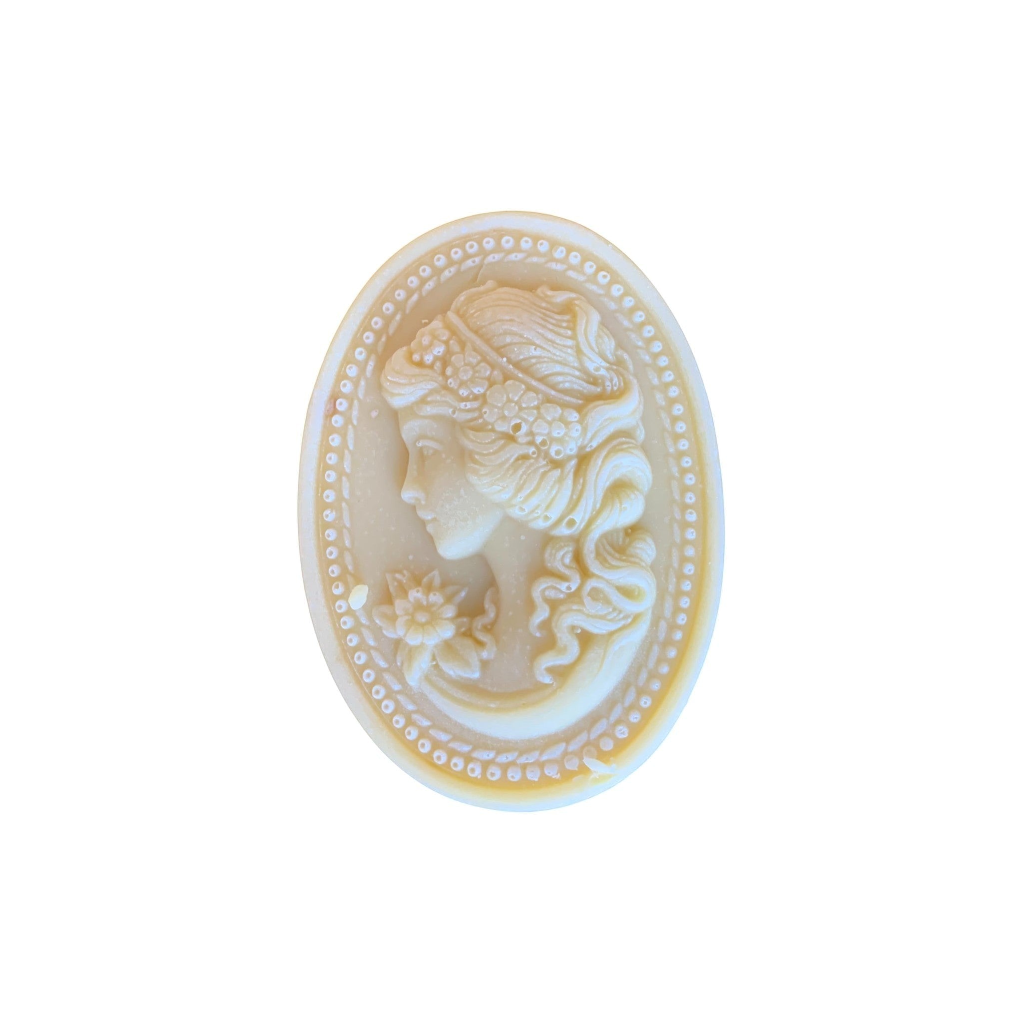 Lise Fiola Creations artisanal soap bar featuring an elegant cream-coloured cameo relief design of a woman's profile.