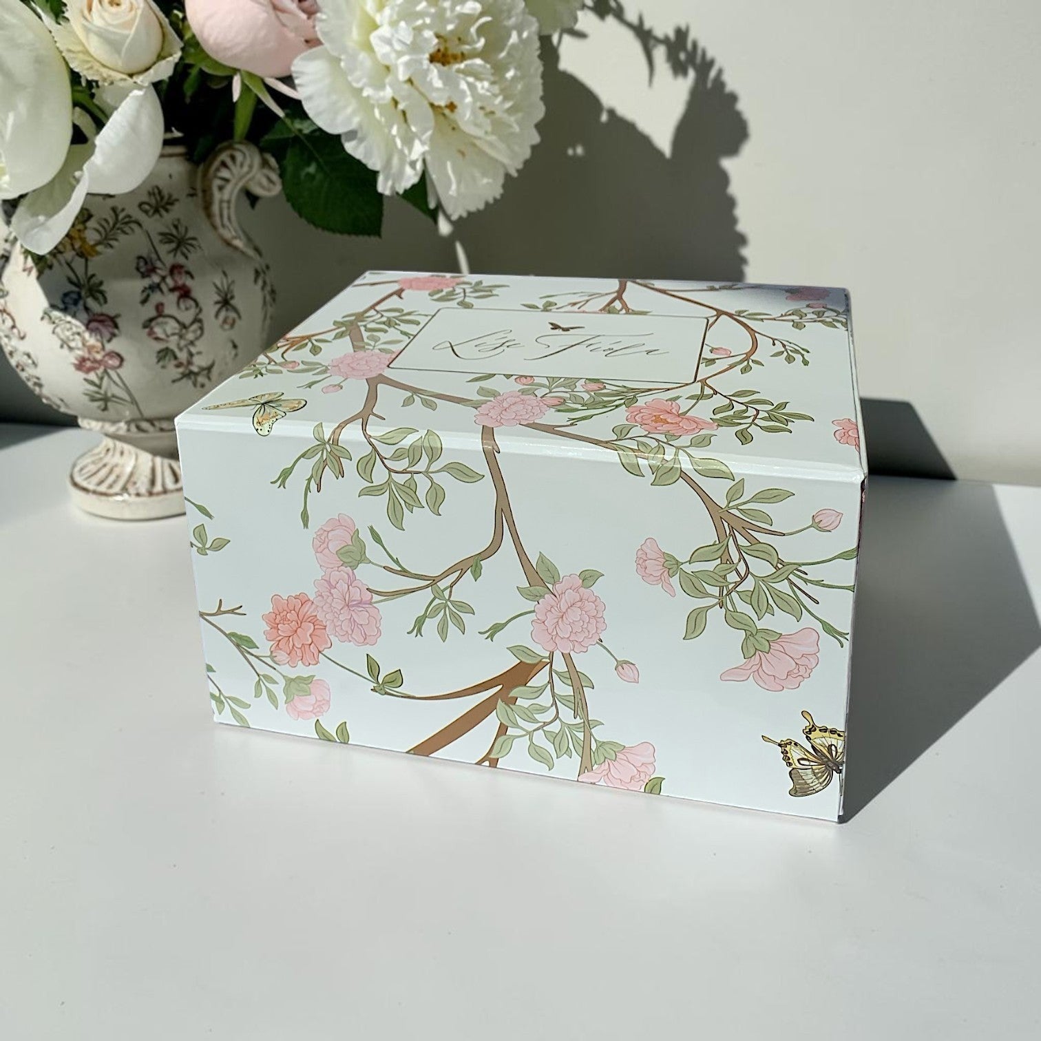 Lise Fiola Creations Warm Embrace gift set in an elegant floral magnetic keepsake box with butterfly illustrations.