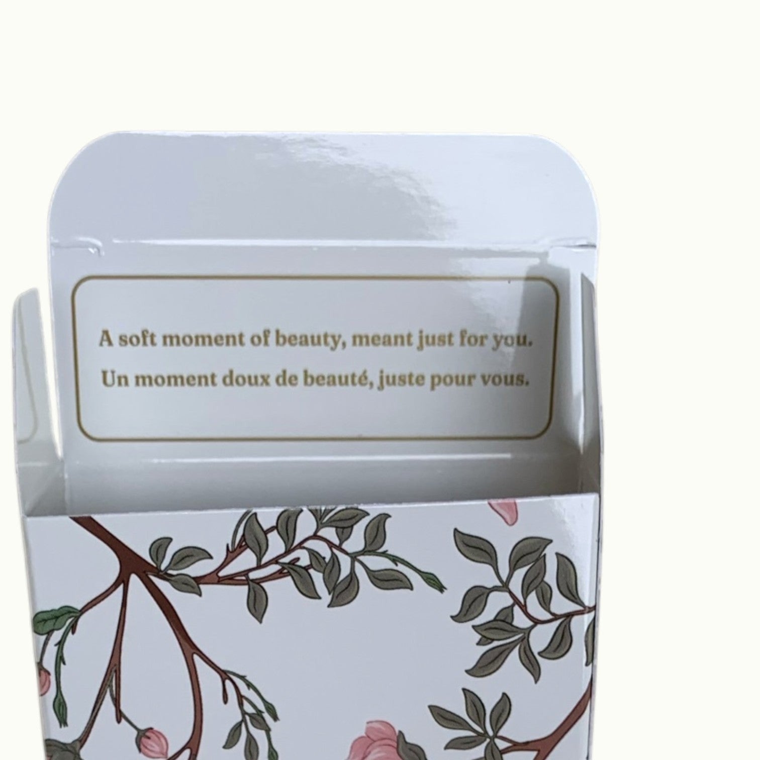 Lise Fiola Creations artisanal soap box featuring floral botanical illustrations and a bilingual message inside.