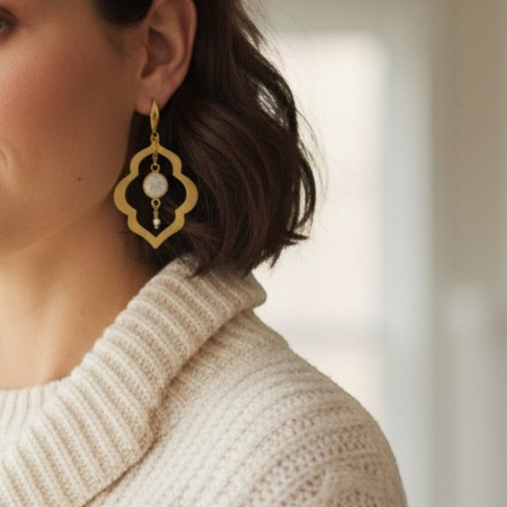 Lise Fiola Creations gold-plated brass earrings with marbled polymer clay and agate stone worn by a woman