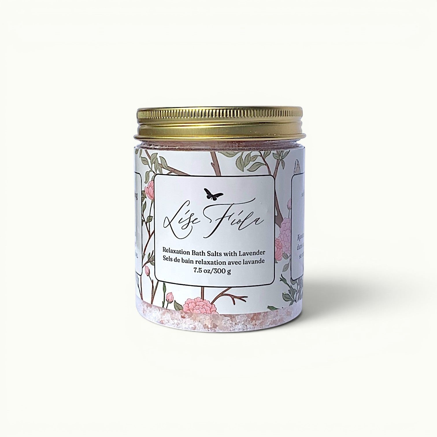 Lise Fiola Creations relaxation bath salts in a glass jar with a gold lid, featuring lavender and Himalayan salt.