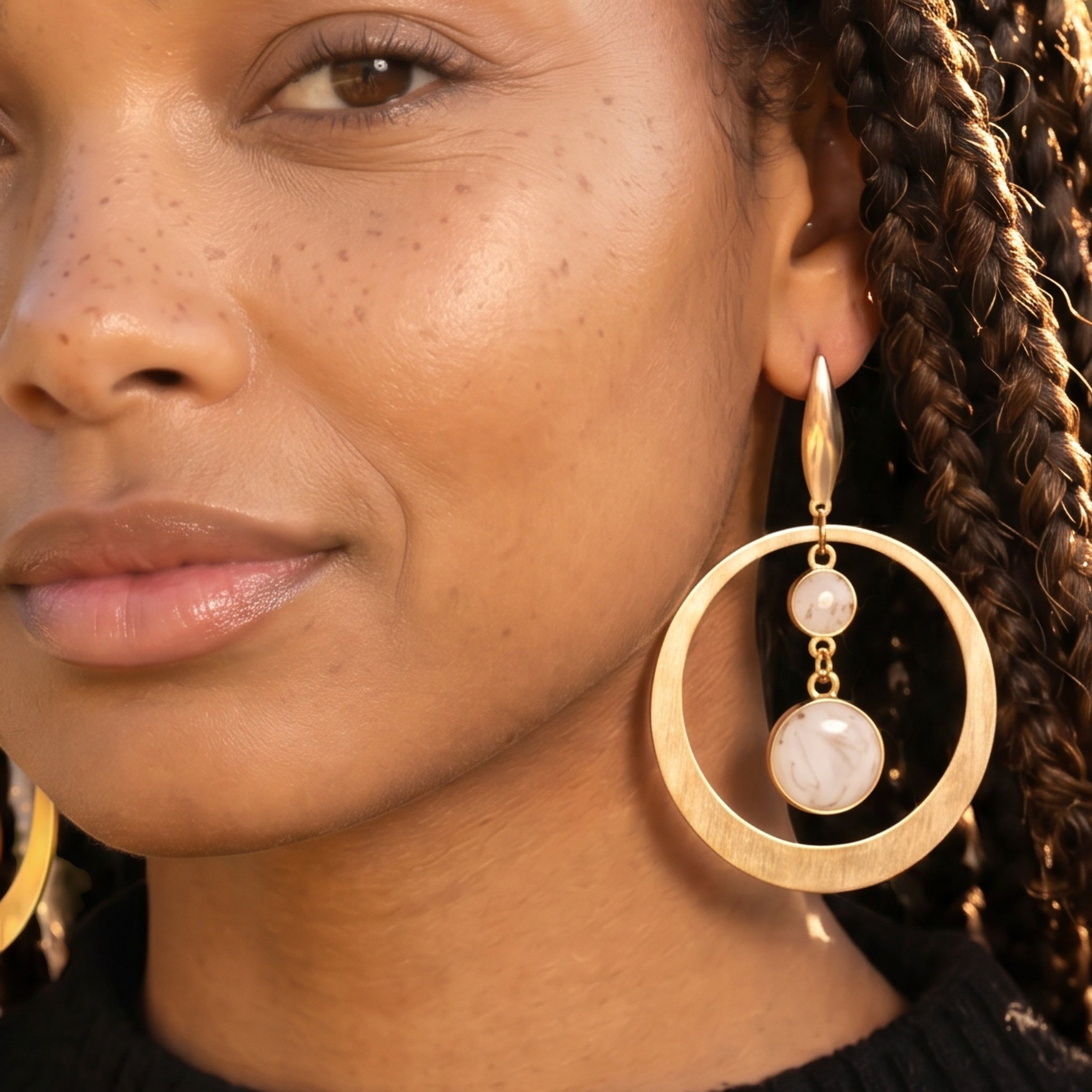 Lise Fiola Creations Luna earrings featuring gold-plated brass hoops and marbled polymer clay on a model