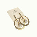 Lise Fiola Creations Luna earrings featuring gold-plated brass hoops and marbled polymer clay in neutral tones.