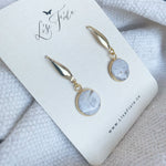 Lise Fiola Creations Forever earrings featuring marbled grey, white, and gold polymer clay in 18k gold-plated brass.
