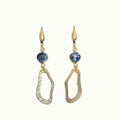 Lise Fiola Creations handmade statement earrings with marbled grey clay, gold-plated brass, and organic shapes.