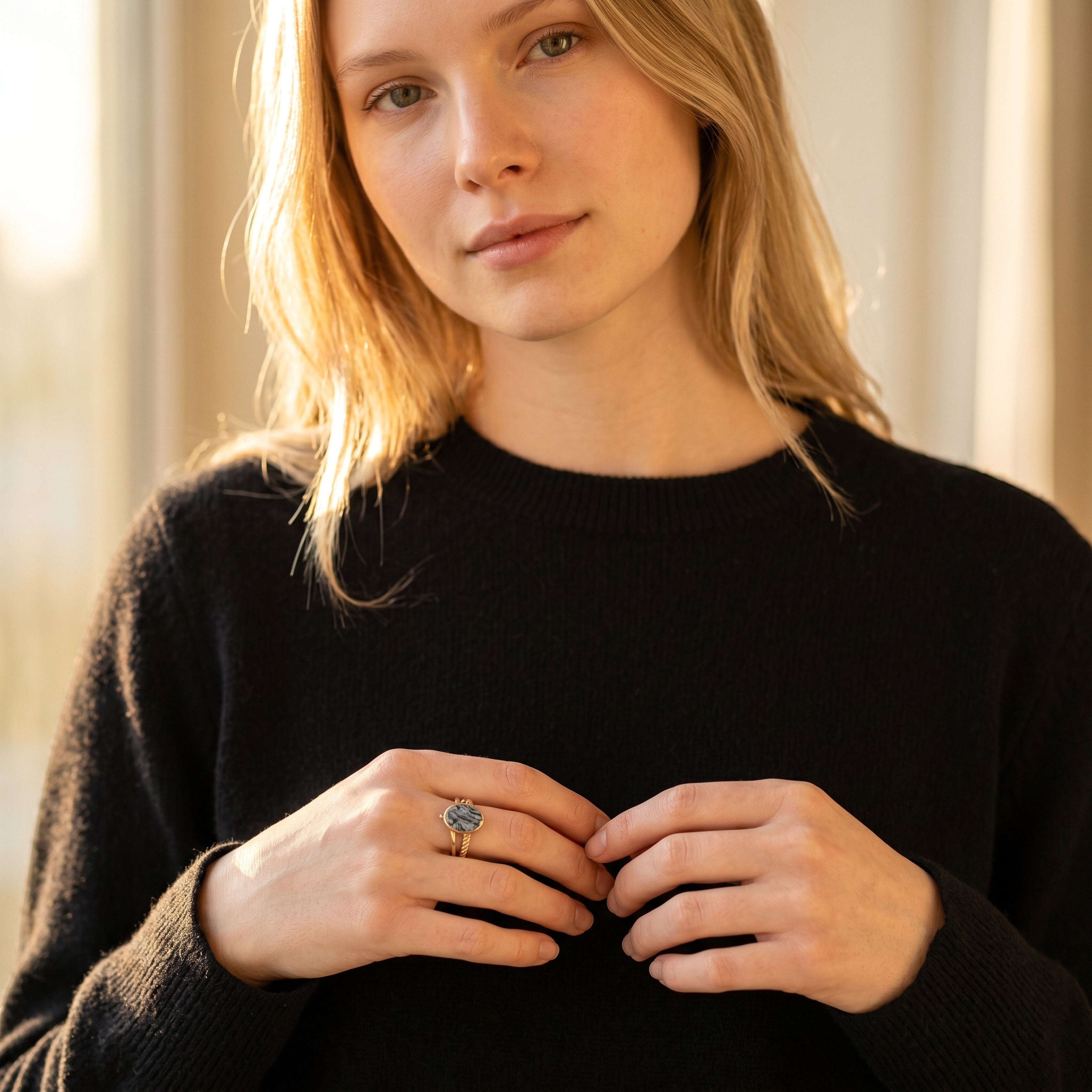 Lise Fiola Creations handmade marbled polymer clay ring with gold plated band worn by a woman in a black sweater