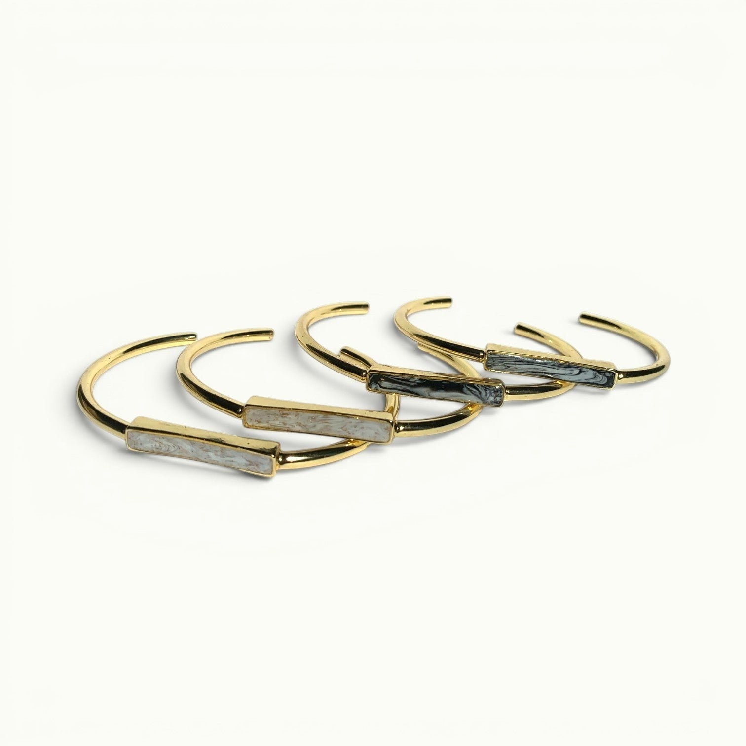 Lise Fiola Creations adjustable gold plated bangle bracelets with marbled polymer clay bar accents in neutral tones.