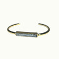 Lise Fiola Creations handcrafted gold plated bangle bracelet with a black and white marbled polymer clay bar.