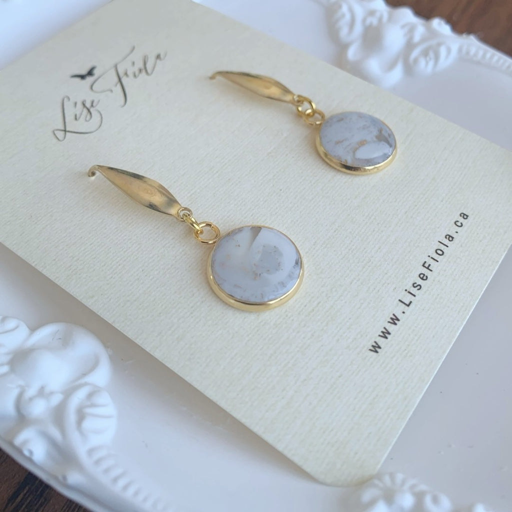 Lise Fiola Creations Forever earrings featuring marbled grey, white, and gold polymer clay in 18k gold-plated brass.