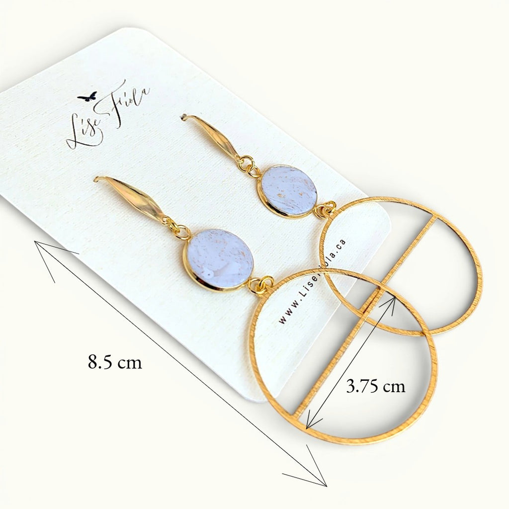 Lise Fiola Creations Delicate Luna earrings featuring marbled polymer clay, gold-plated brass, and large circular hoops.