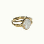 Lise Fiola Creations handmade adjustable ring with a marbled beige and gold polymer clay oval on a gold plated band.