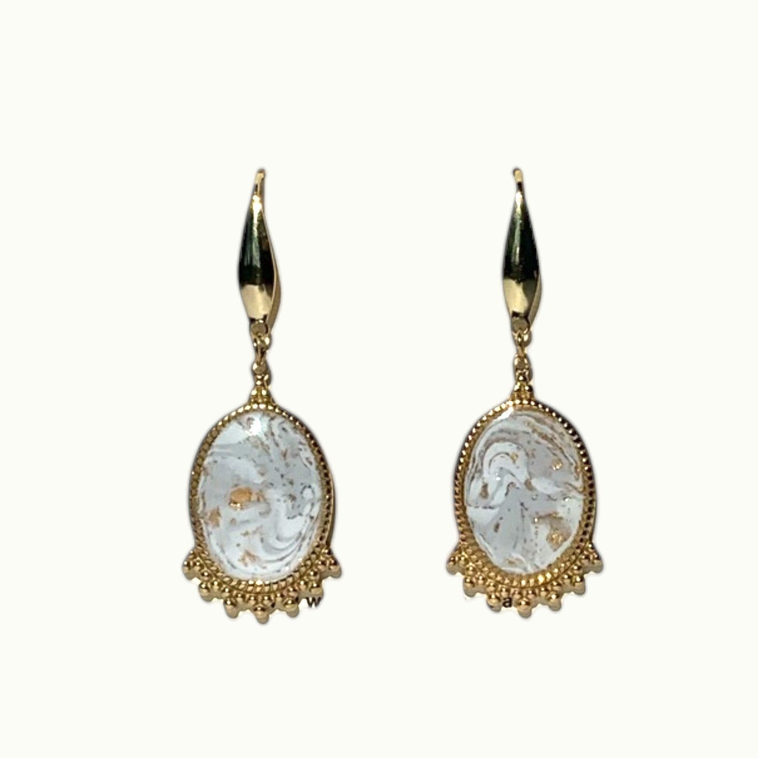 Lise Fiola Creations oval drop earrings featuring marbled grey, white, and gold clay with 18k gold-plated brass accents.