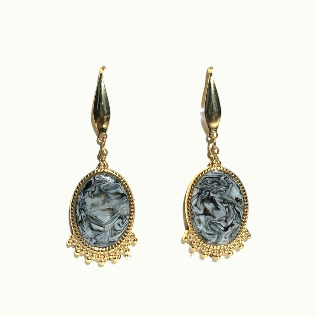 Lise Fiola Creations oval drop earrings featuring marbled black, white, and grey clay with 18k gold-plated accents.