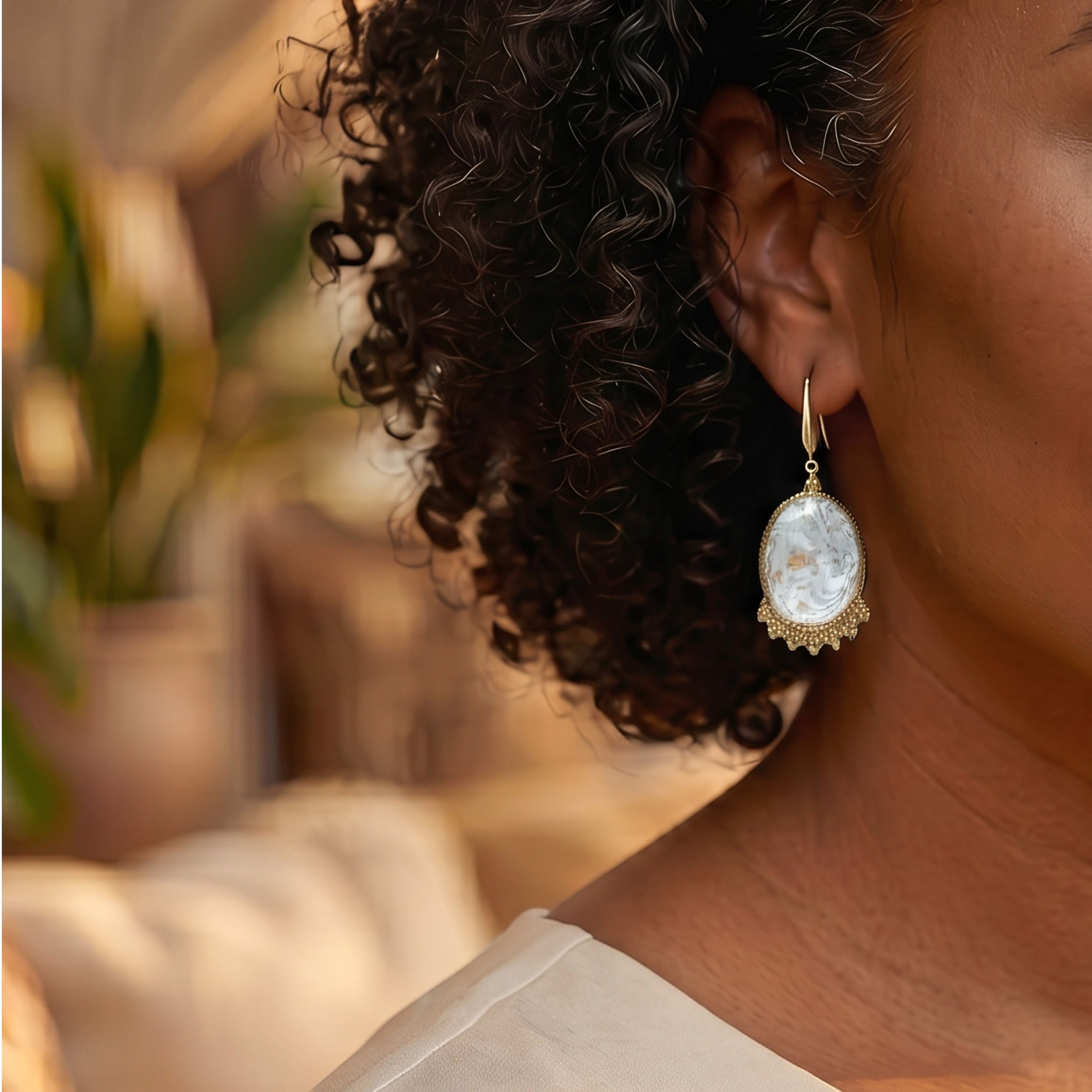 Lise Fiola Creations oval drop earrings featuring marbled grey, white, and gold polymer clay with gold-plated brass.