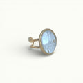 Lise Fiola Creations handmade oval ring with a light marble polymer clay inlay on an adjustable gold plated band.