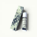 Lise Fiola Creations peppermint beeswax lip balm in elegant toile de Jouy packaging with a matching tube.