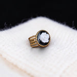 Lise Fiola Creations handcrafted adjustable ring with a white rose on a black background and 18k gold plated band.