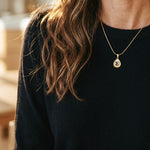 Lise Fiola Creations Sun Ray Drop necklace with dark marbled polymer clay in a 14K gold-plated bezel on a snake chain