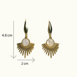 Lise Fiola Creations Sun Ray earrings featuring marbled polymer clay, 14k gold-plated stainless steel, and sunburst design