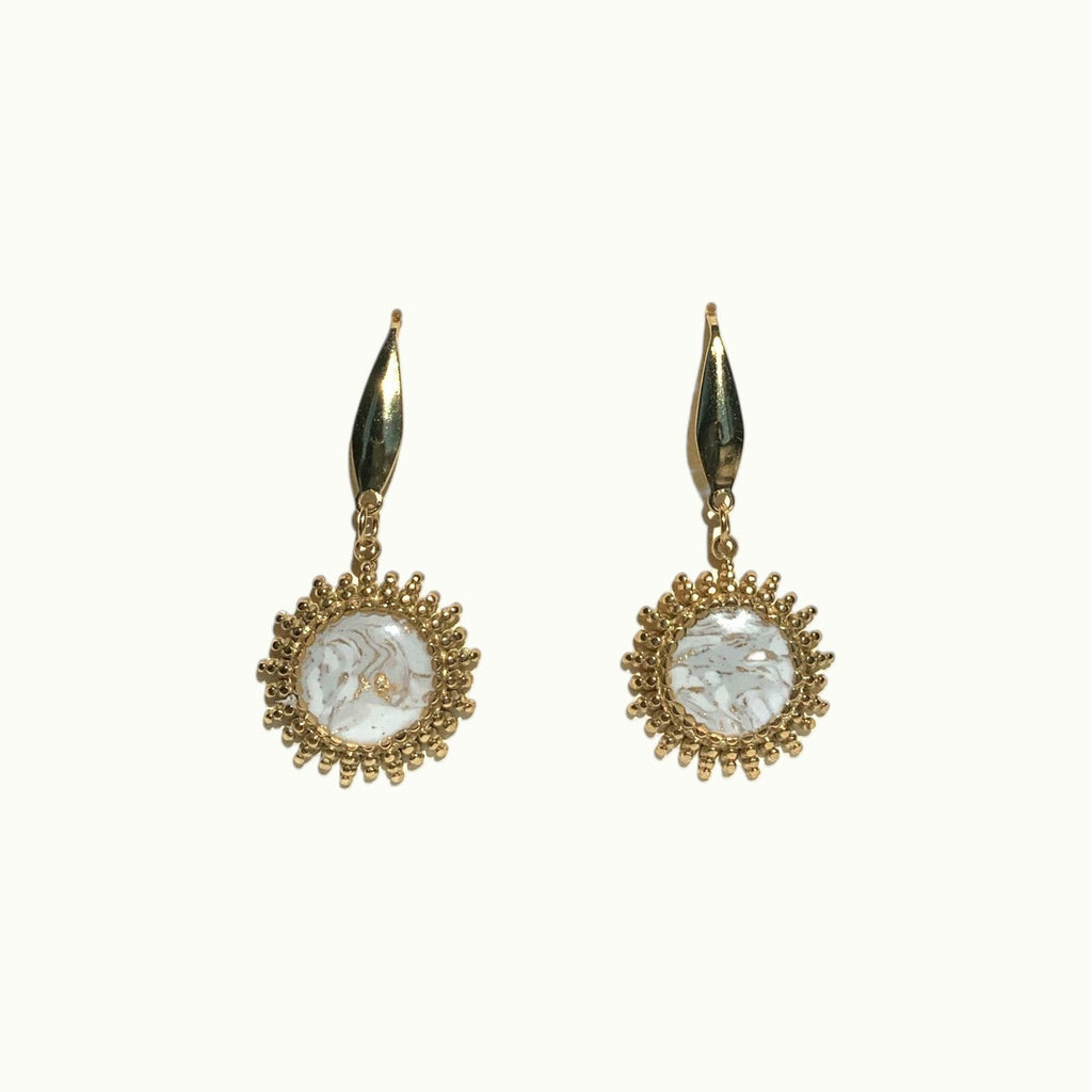 Lise Fiola Creations Sunshine earrings featuring marbled polymer clay in gold-plated stainless steel sunburst settings.