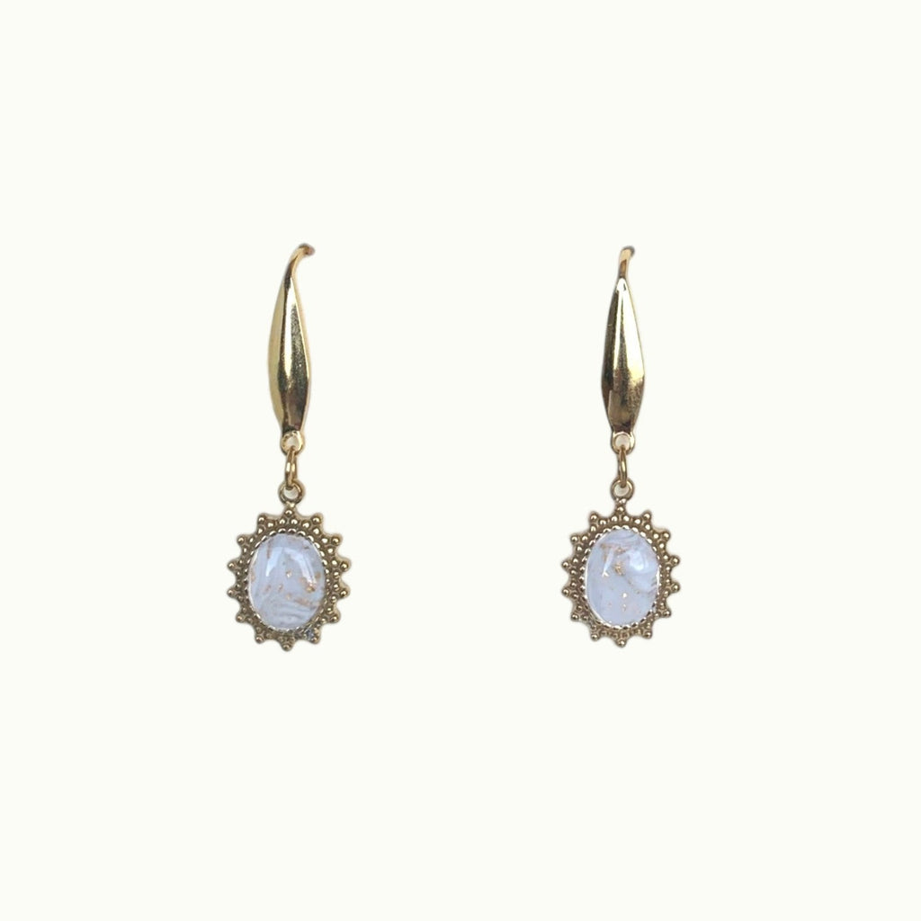 Lise Fiola Creations Sunshine Oval earrings featuring marbled beige and white clay in gold-plated scalloped settings.