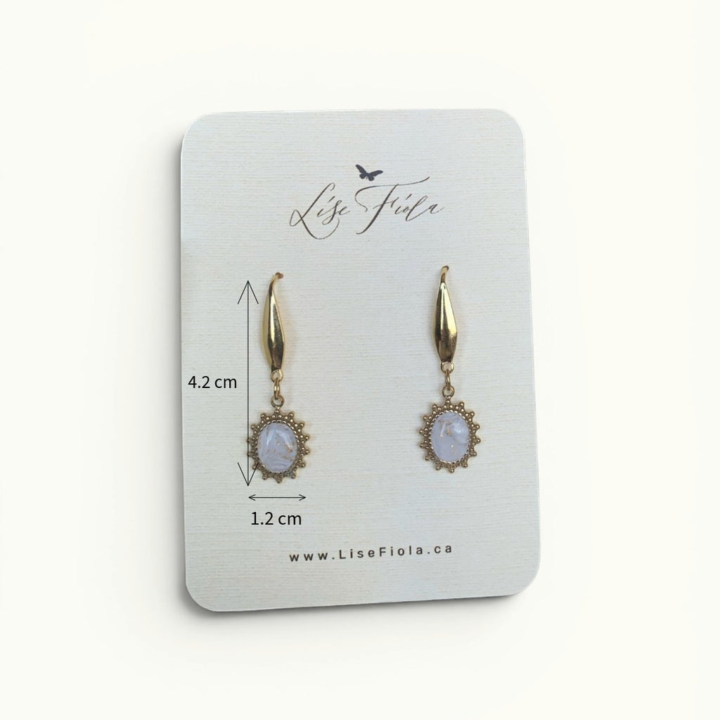 Lise Fiola Creations Sunshine Oval earrings featuring marbled beige and gold accents on 14k gold-plated stainless steel.