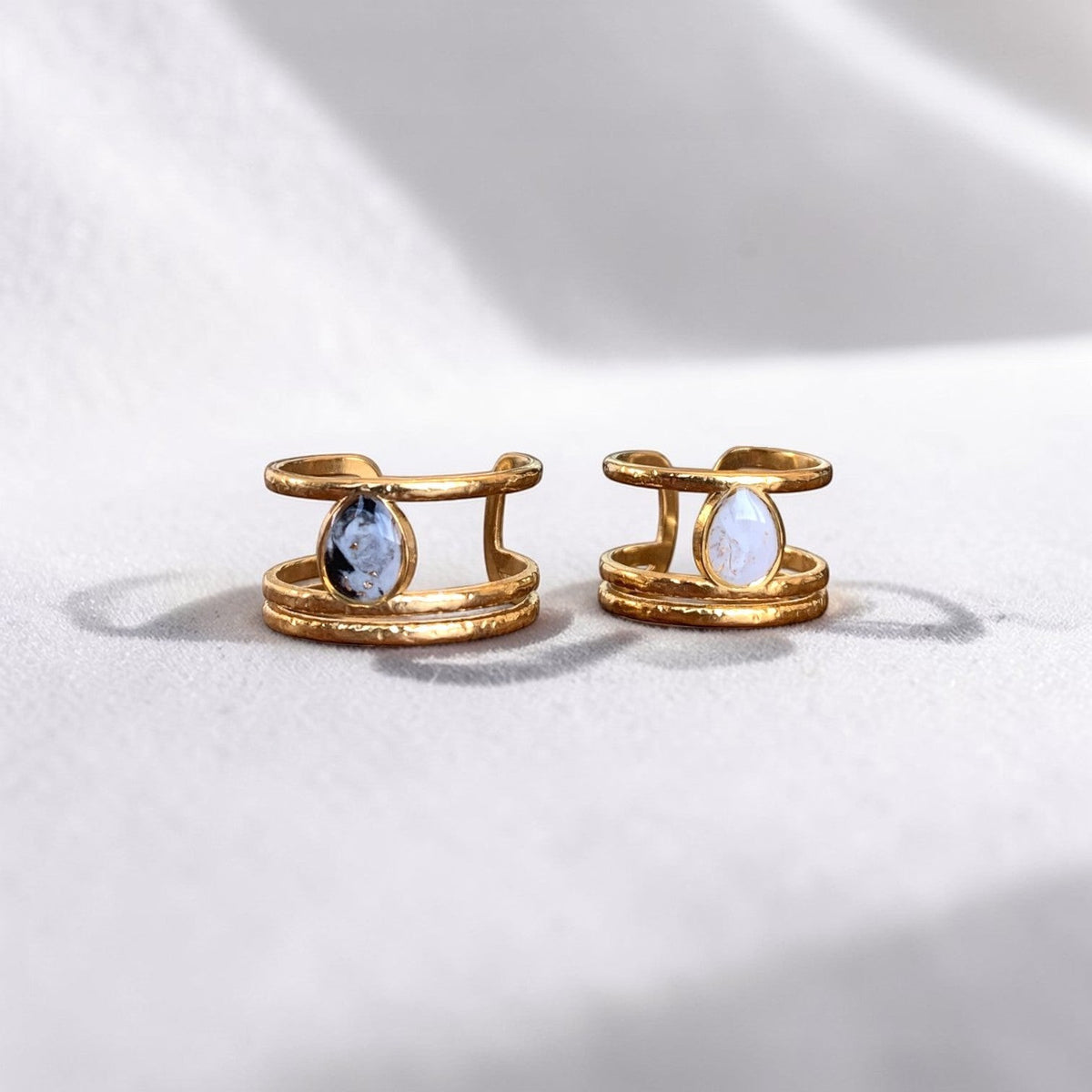 Lise Fiola Creations triple band rings in 18k gold plated stainless steel with marbled polymer clay teardrop accents.