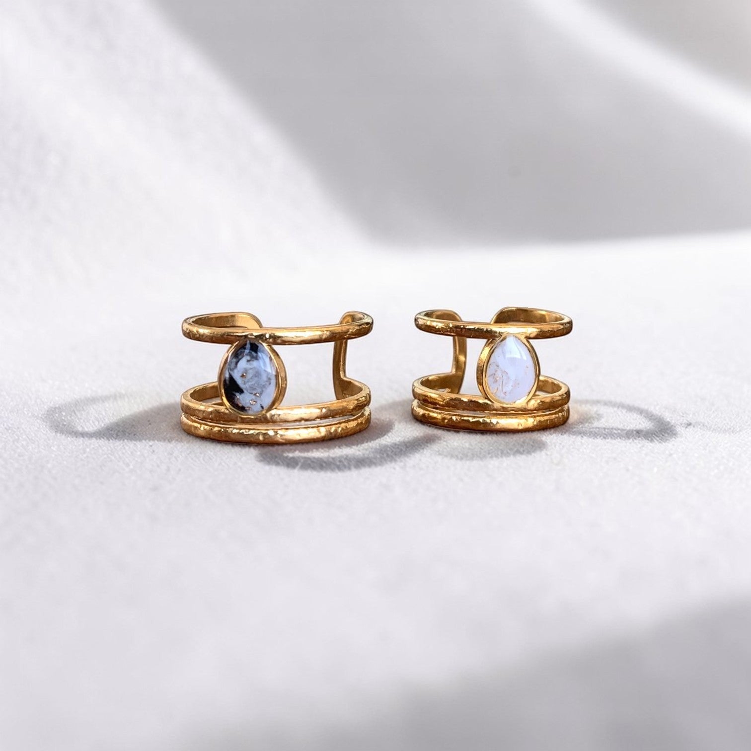 Lise Fiola Creations triple band rings in 18k gold plated stainless steel with marbled polymer clay teardrop accents.