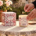 Lise Fiola Creations vanilla coconut soy wax candle in a floral glass jar with a matching magnetic keepsake gift box.