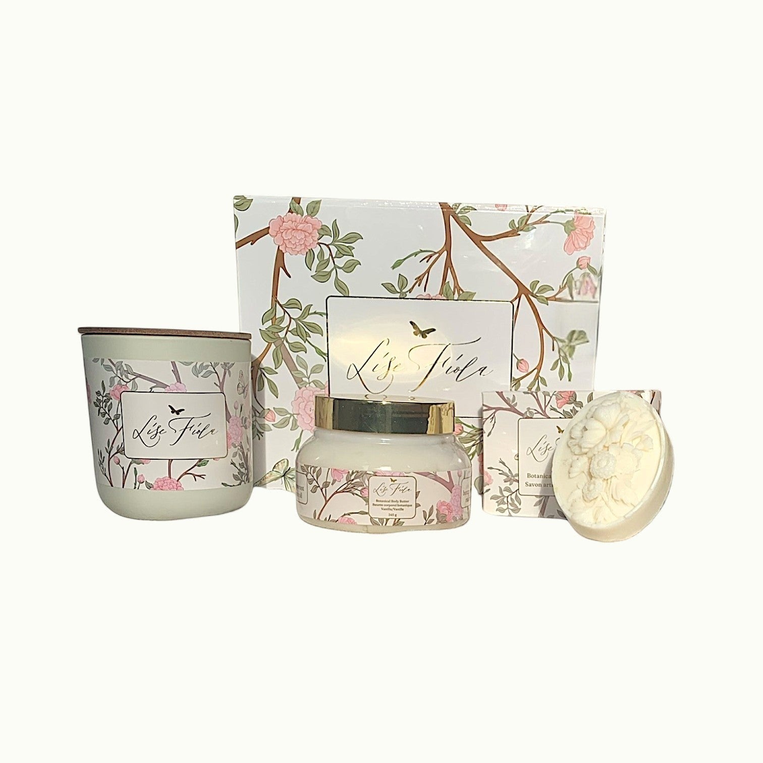Lise Fiola Creations Warm Embrace gift set with vanilla body butter, botanical soap, and candle in a floral box.