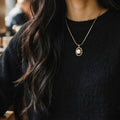 Lise Fiola Creations white rose polymer clay pendant necklace in an 18k gold plated bezel on a gold snake chain.