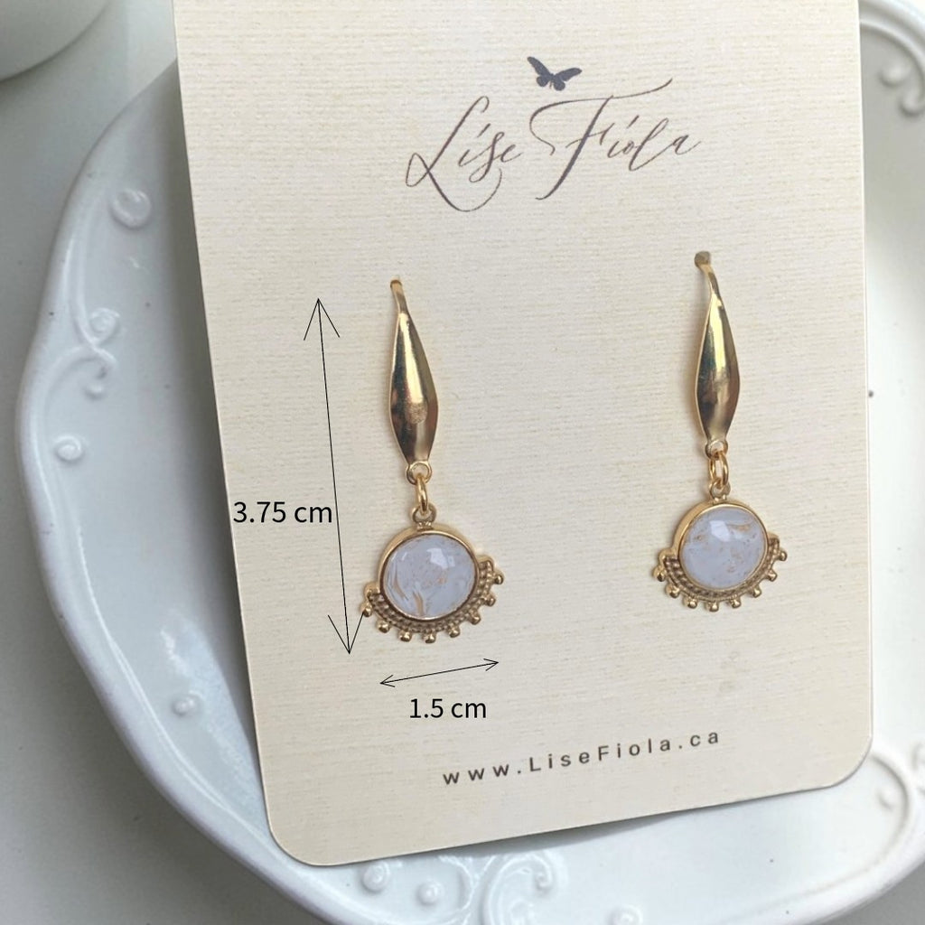 Lise Fiola Creations Wink light earrings featuring marbled polymer clay, 14k gold-plated stainless steel, and gold accents.