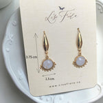 Lise Fiola Creations Wink light earrings featuring marbled polymer clay, 14k gold-plated stainless steel, and gold accents.